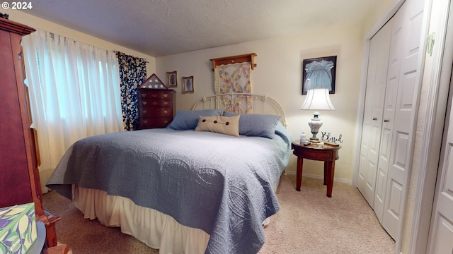 bedroom featuring carpet flooring, a closet, and baseboards