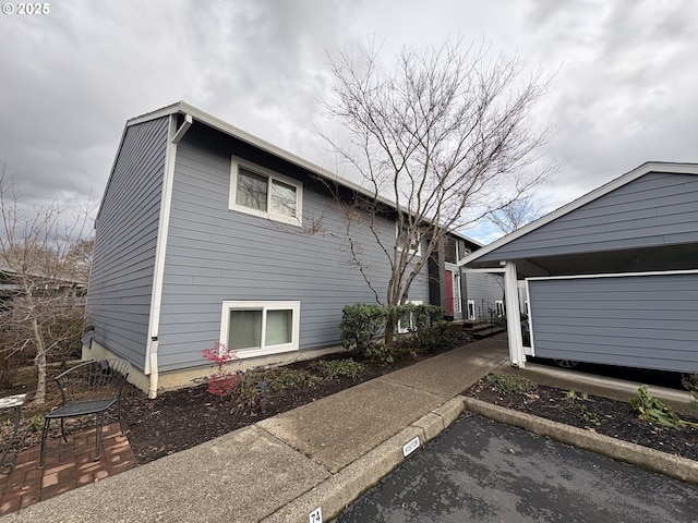 view of side of property with a garage