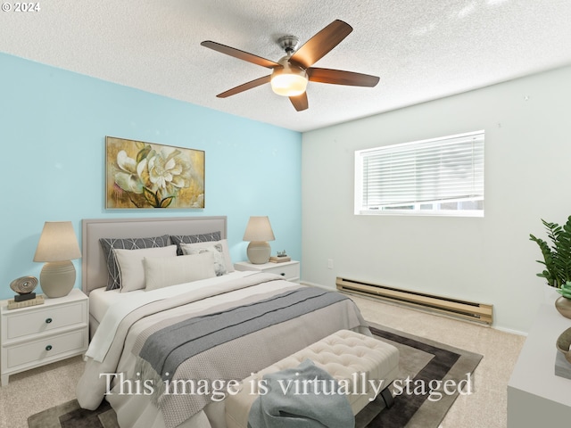 carpeted bedroom with a baseboard heating unit, a textured ceiling, and ceiling fan