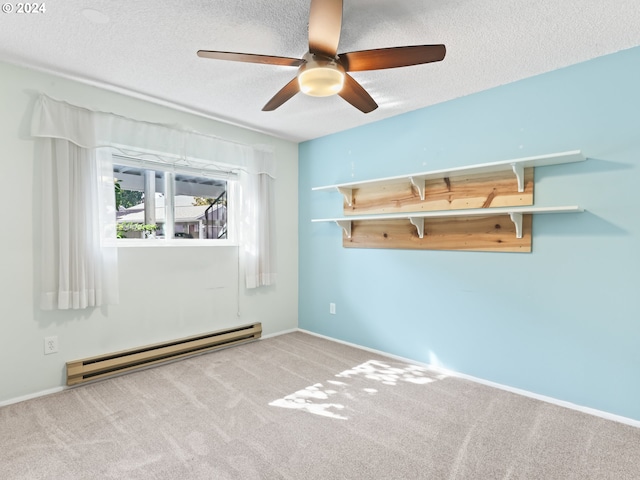 10940 SW Meadowbrook Dr Unit 29, Portland, OR 97224 - empty room featuring a baseboard heating unit, a textured ceiling, ceiling fan, carpet flooring, and baseboards