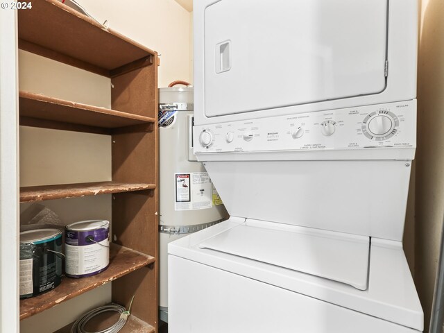 clothes washing area featuring stacked washer and clothes dryer