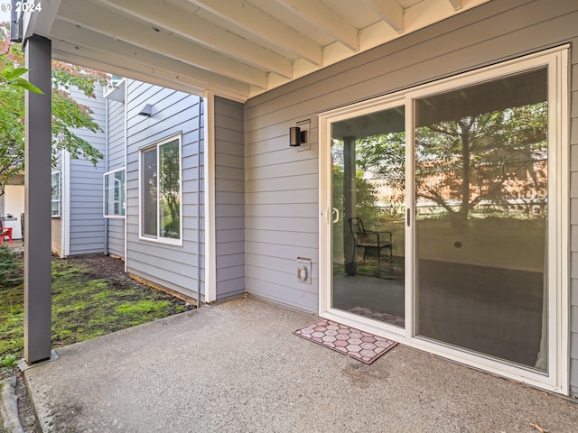 entrance to property featuring a patio area