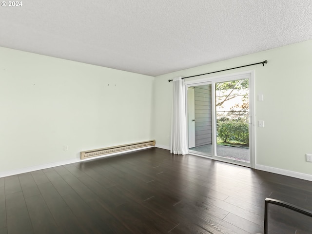 10940 SW Meadowbrook Dr Unit 29, Portland, OR 97224 - unfurnished room with a baseboard heating unit, a textured ceiling, dark wood-type flooring, and baseboards
