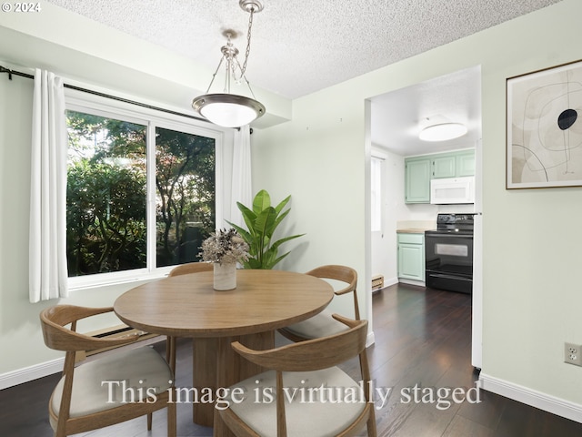 dining space featuring a textured ceiling and dark hardwood / wood-style flooring