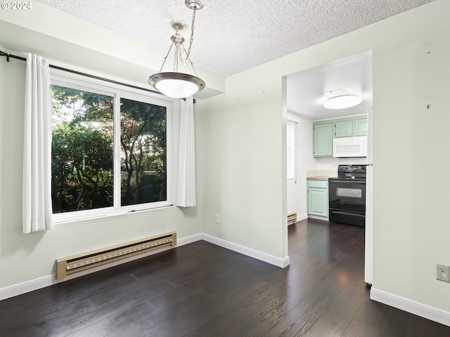 unfurnished dining area featuring dark hardwood / wood-style floors, a textured ceiling, and a baseboard heating unit