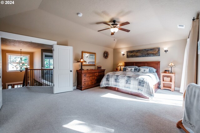 bedroom with ceiling fan, carpet, and lofted ceiling