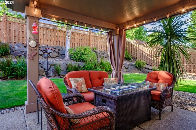 view of patio / terrace with an outdoor fire pit