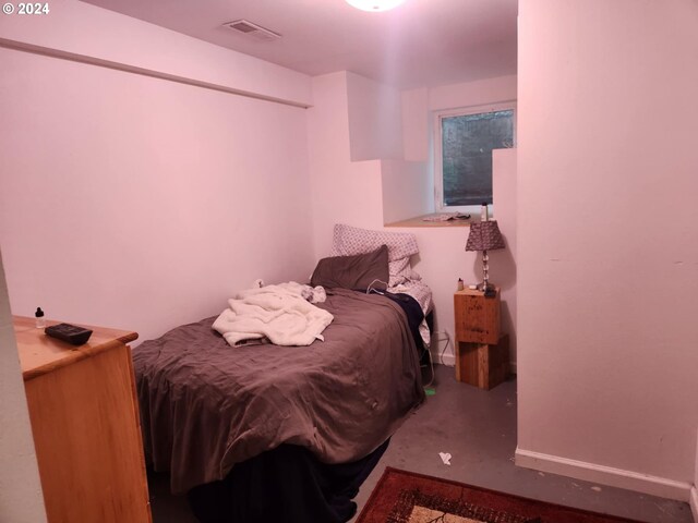 bedroom with concrete flooring