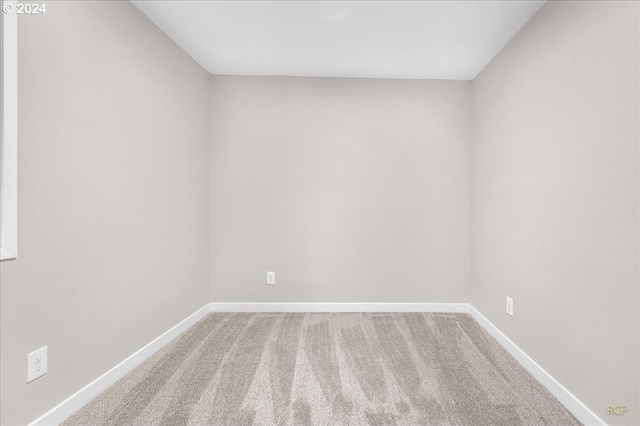 empty room with carpet flooring