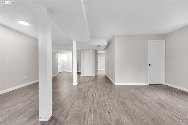 basement featuring hardwood / wood-style flooring