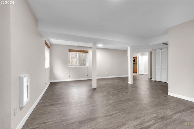 basement with dark wood-type flooring