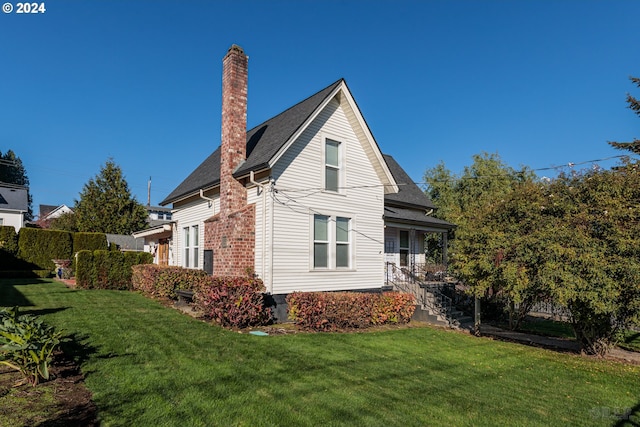 view of home's exterior featuring a lawn