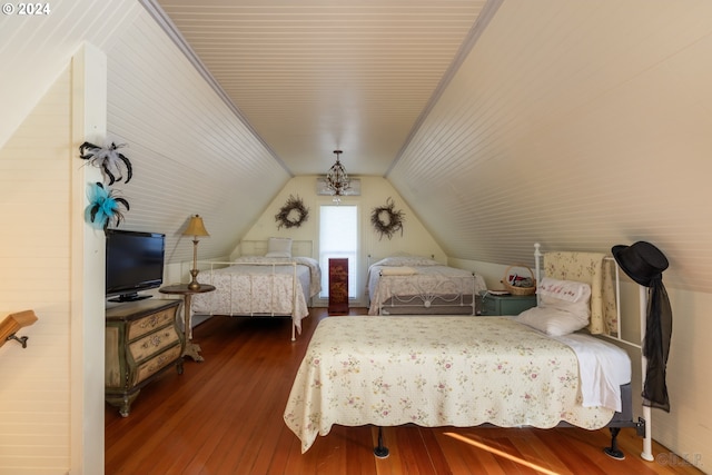 bedroom featuring dark wood-type flooring and vaulted ceiling