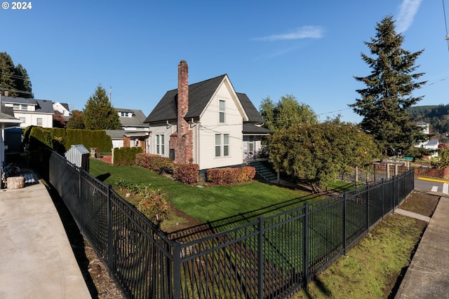 view of home's exterior with a yard