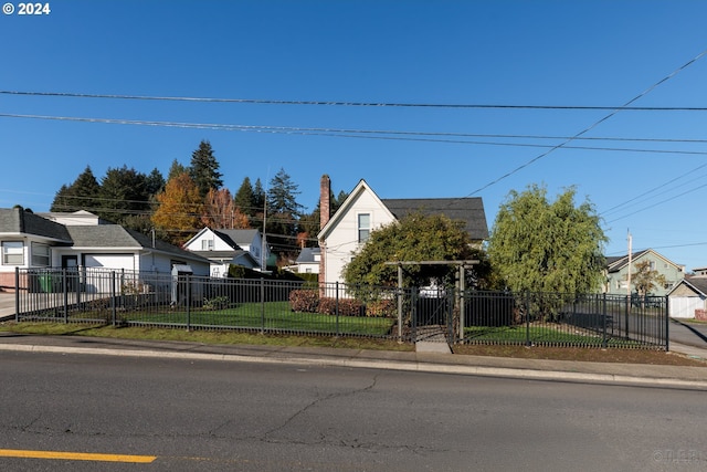 view of front of property featuring a front yard and a garage