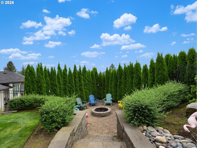 view of patio with a fire pit