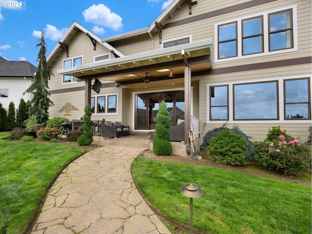 back of house featuring a patio, a yard, and ceiling fan