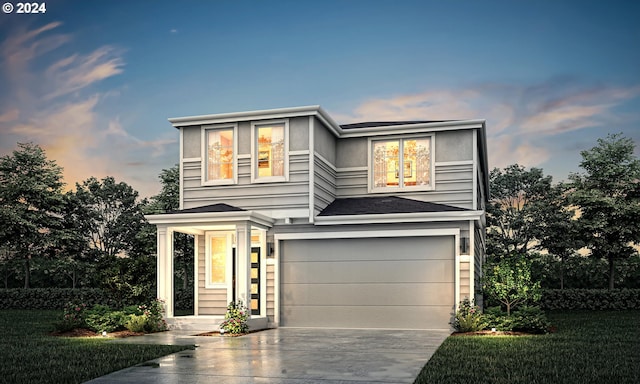 view of front of property featuring driveway and an attached garage