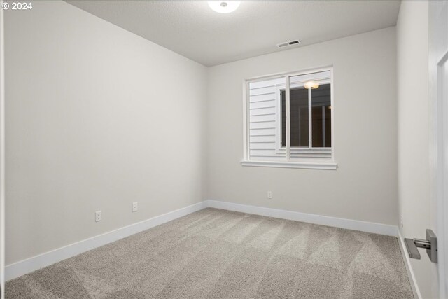 spare room with carpet flooring