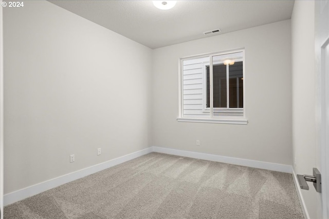 13886 SW Sabrina Ave, Tigard, OR 97140 - carpeted spare room with visible vents and baseboards