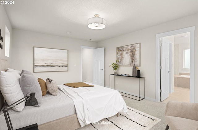 13886 SW Sabrina Ave, Tigard, OR 97140 - bedroom with ensuite bath, baseboards, and carpet flooring
