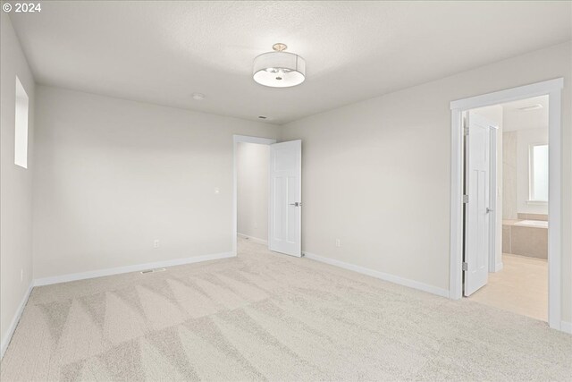 carpeted bedroom with connected bathroom