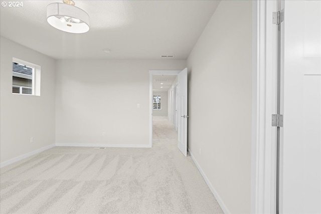 13886 SW Sabrina Ave, Tigard, OR 97140 - spare room with light carpet, visible vents, and baseboards