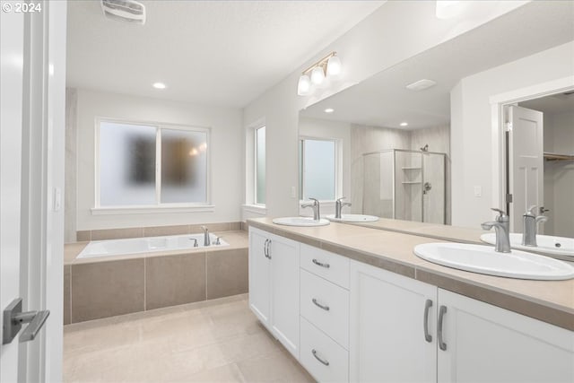 bathroom featuring vanity, tile patterned floors, and independent shower and bath