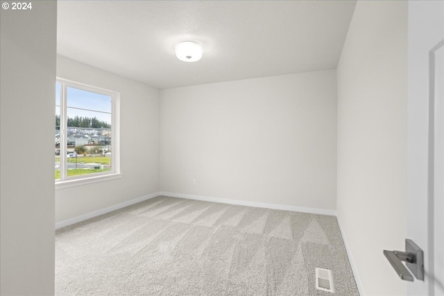 13886 SW Sabrina Ave, Tigard, OR 97140 - carpeted empty room with baseboards and visible vents