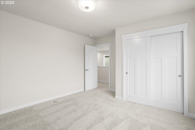 empty room with light colored carpet