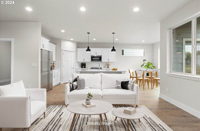13886 SW Sabrina Ave, Tigard, OR 97140 - living room with baseboards, recessed lighting, and light wood-type flooring