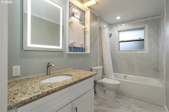 full bathroom featuring vanity, marble finish floor, shower / bath combo, and toilet