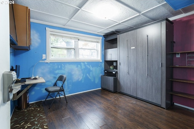 office with dark hardwood / wood-style flooring