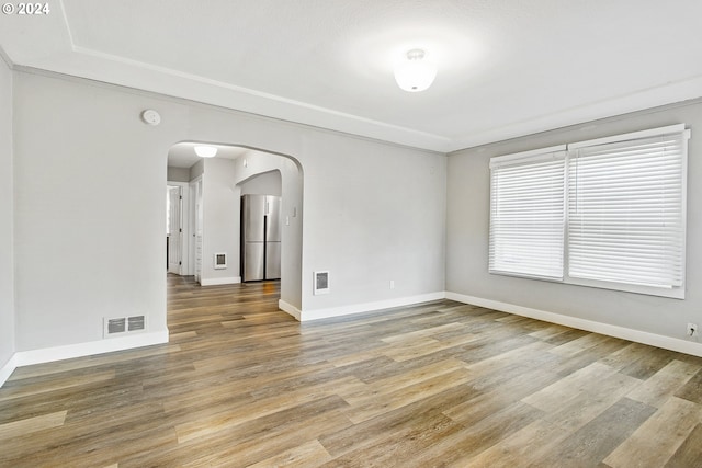 empty room featuring hardwood / wood-style flooring