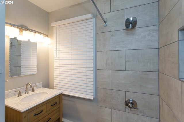 full bath featuring walk in shower and vanity