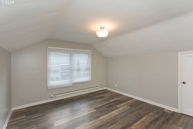 bonus room with vaulted ceiling, dark wood-type flooring, and a baseboard heating unit