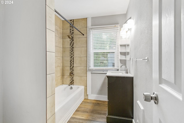 full bathroom featuring shower / bathing tub combination, wood finished floors, and vanity