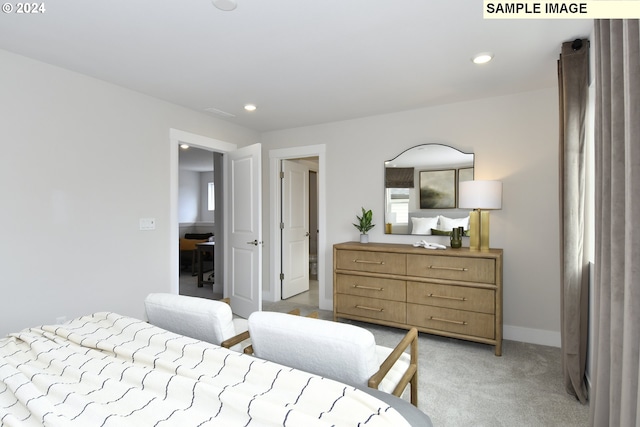 bedroom with light colored carpet