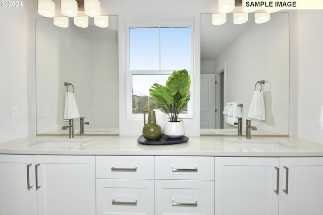 bathroom with plenty of natural light and vanity