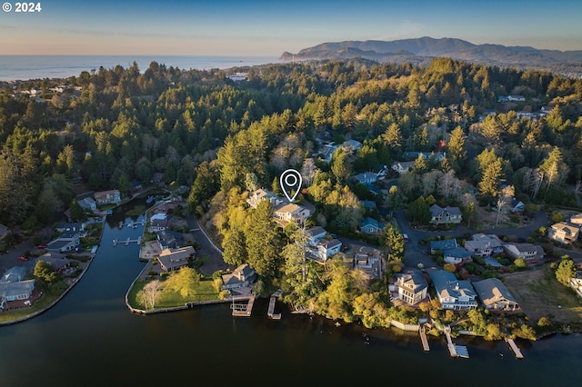 aerial view at dusk with a water view