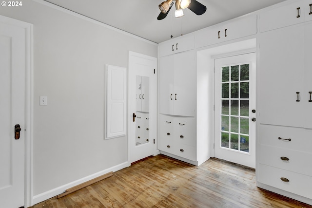 1212 Laurel St Unit 9, Lake Oswego, OR 97034 - unfurnished bedroom featuring multiple windows, light wood-type flooring, baseboards, and a ceiling fan