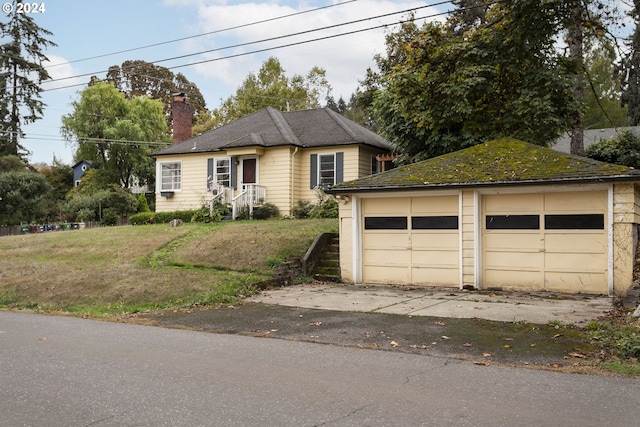 1212 Laurel St Unit 9, Lake Oswego, OR 97034 - view of front of property featuring a chimney, a garage, and an outbuilding