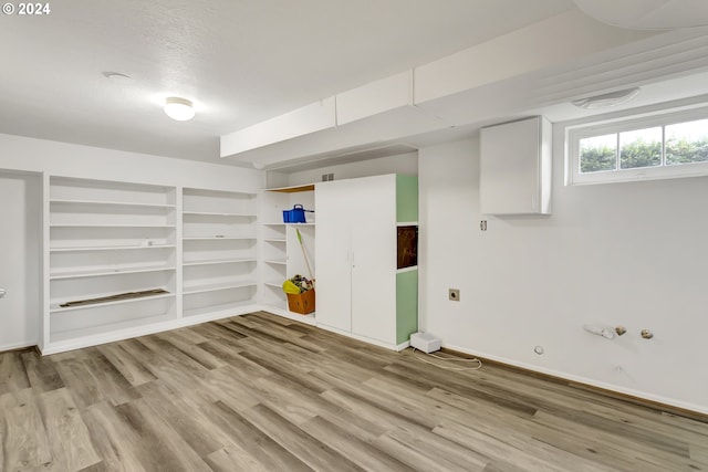 1212 Laurel St Unit 9, Lake Oswego, OR 97034 - below grade area featuring light wood-type flooring, baseboards, and built in shelves