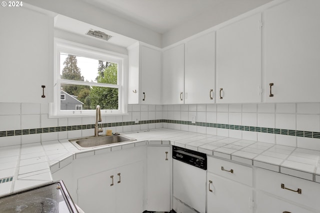 1212 Laurel St Unit 9, Lake Oswego, OR 97034 - kitchen with dishwasher, a sink, white cabinetry, and tile counters