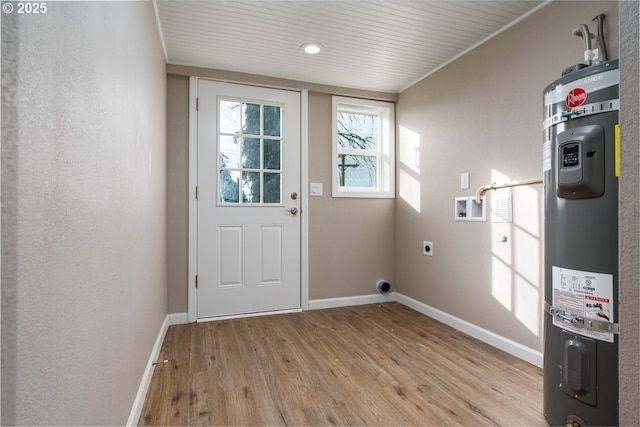 entryway featuring secured water heater and light hardwood / wood-style flooring