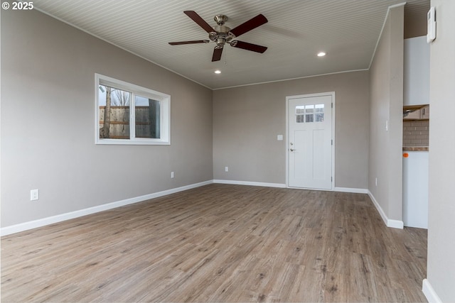 spare room with light hardwood / wood-style floors and ceiling fan