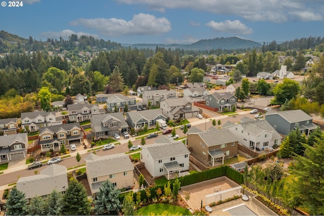 birds eye view of property with a mountain view