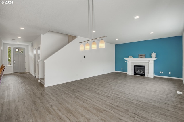 unfurnished living room featuring hardwood / wood-style flooring