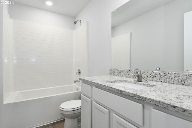 full bathroom with shower / washtub combination, hardwood / wood-style floors, vanity, and toilet