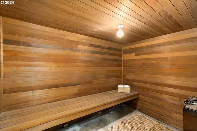 view of sauna with wooden walls